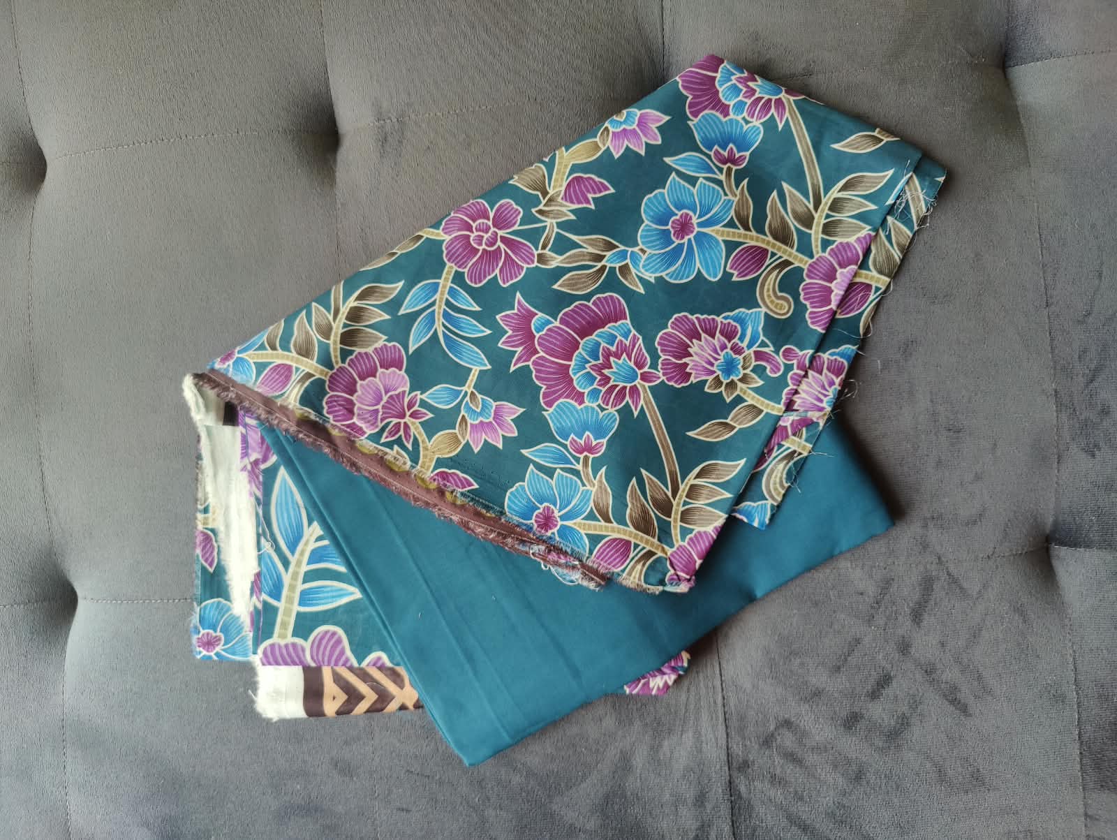 Nishat Unstitched 3-Piece Suit fabric close-up – teal floral print